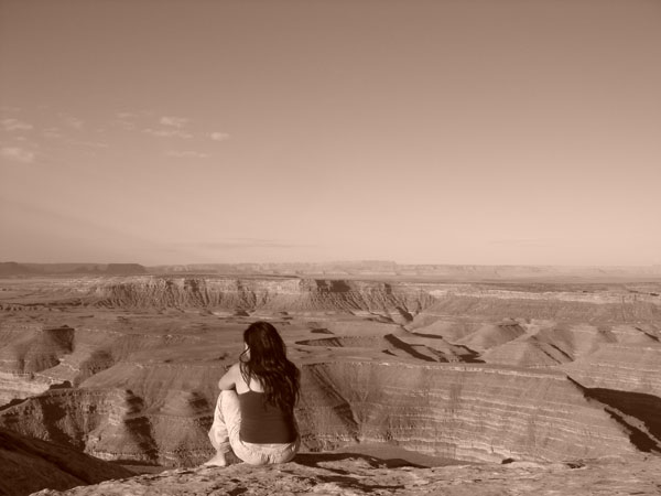 Me sitting on the edge of a cliff at Muley Point, Utah
