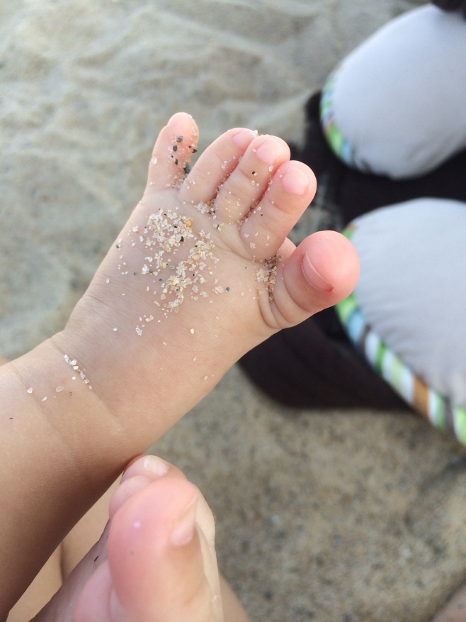 Sand on baby toes