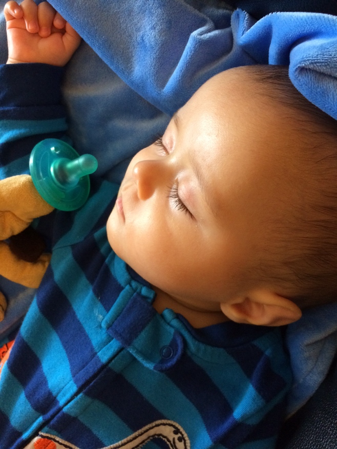 Baby sleeping on blue blanket