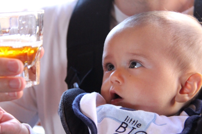 Baby staring at beer