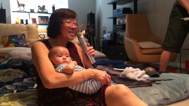 Grandma and baby singing karaoke