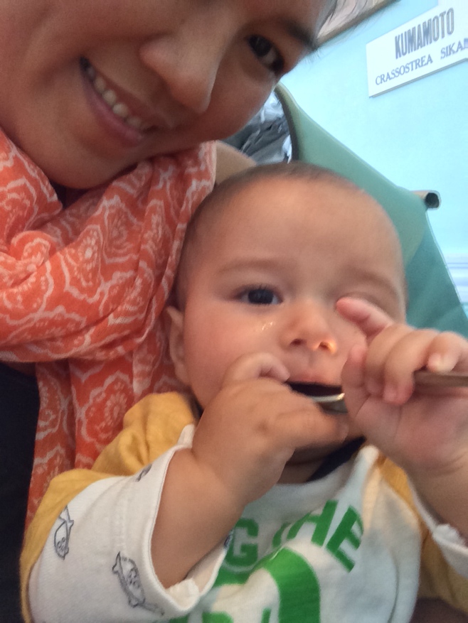 Baby with spoon in mouth