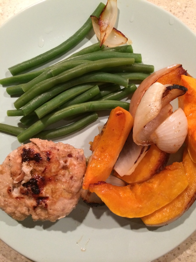 Turkey sausage, butternut squash and green beans on a plate
