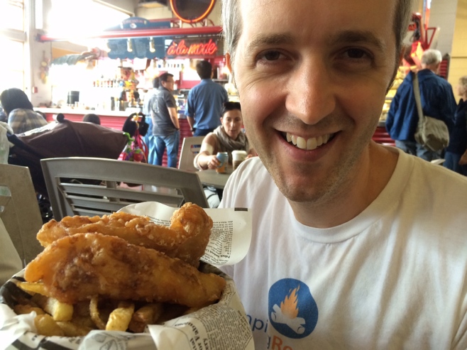 Man holding fish and chips