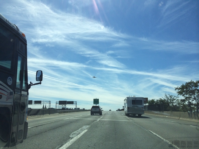 RV with plane flying overhead