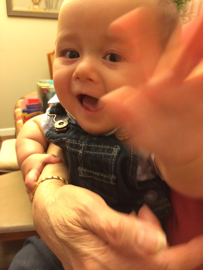 Baby reaching for camera