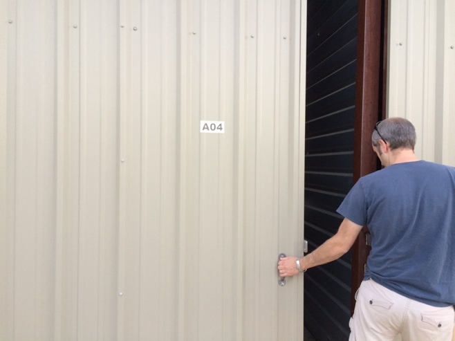 Man closing door of RV storage