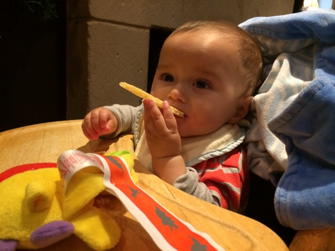 Baby eating pate and crackers