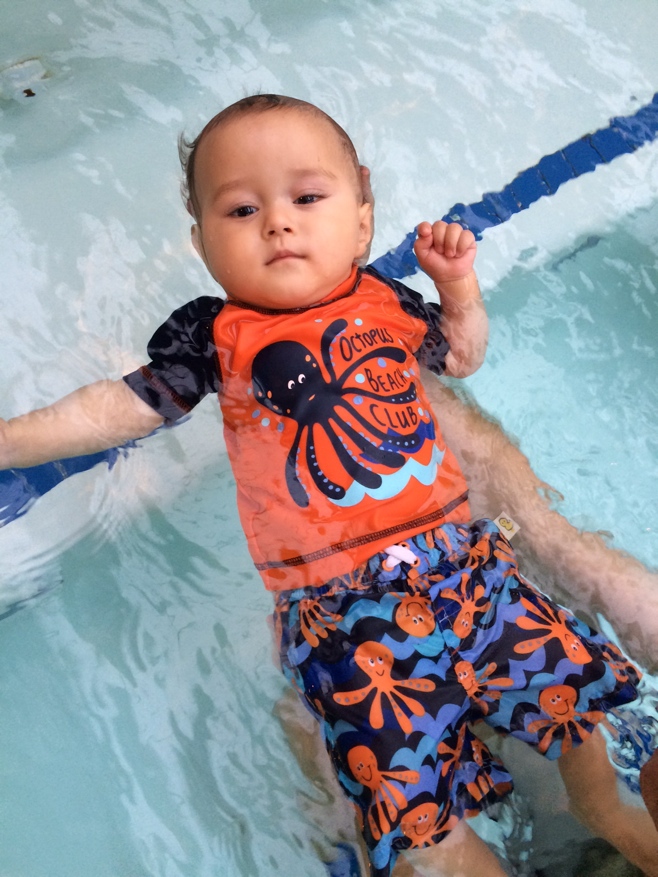 Baby floating in a pool