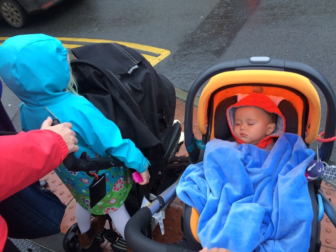 Baby in stroller with toddler friends