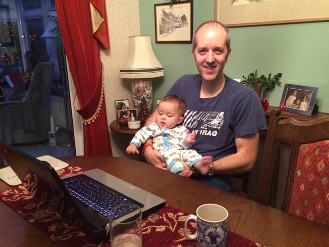 Man and baby with laptop