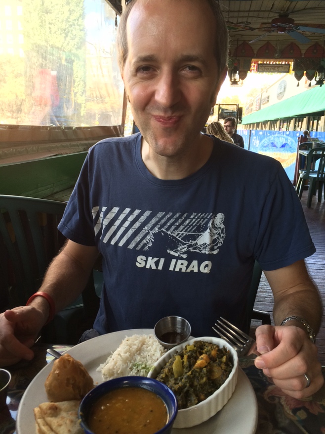 Happy man with Indian food