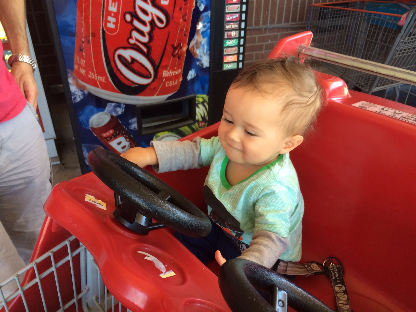 Baby boy o in car shopping cart