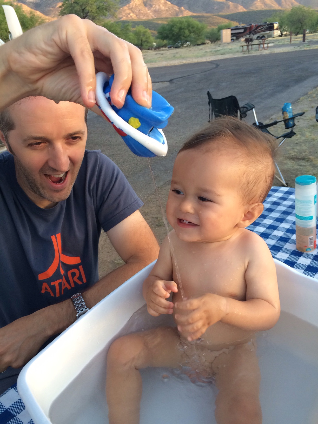 English hubby giving baby boy o bath and squirting boat 