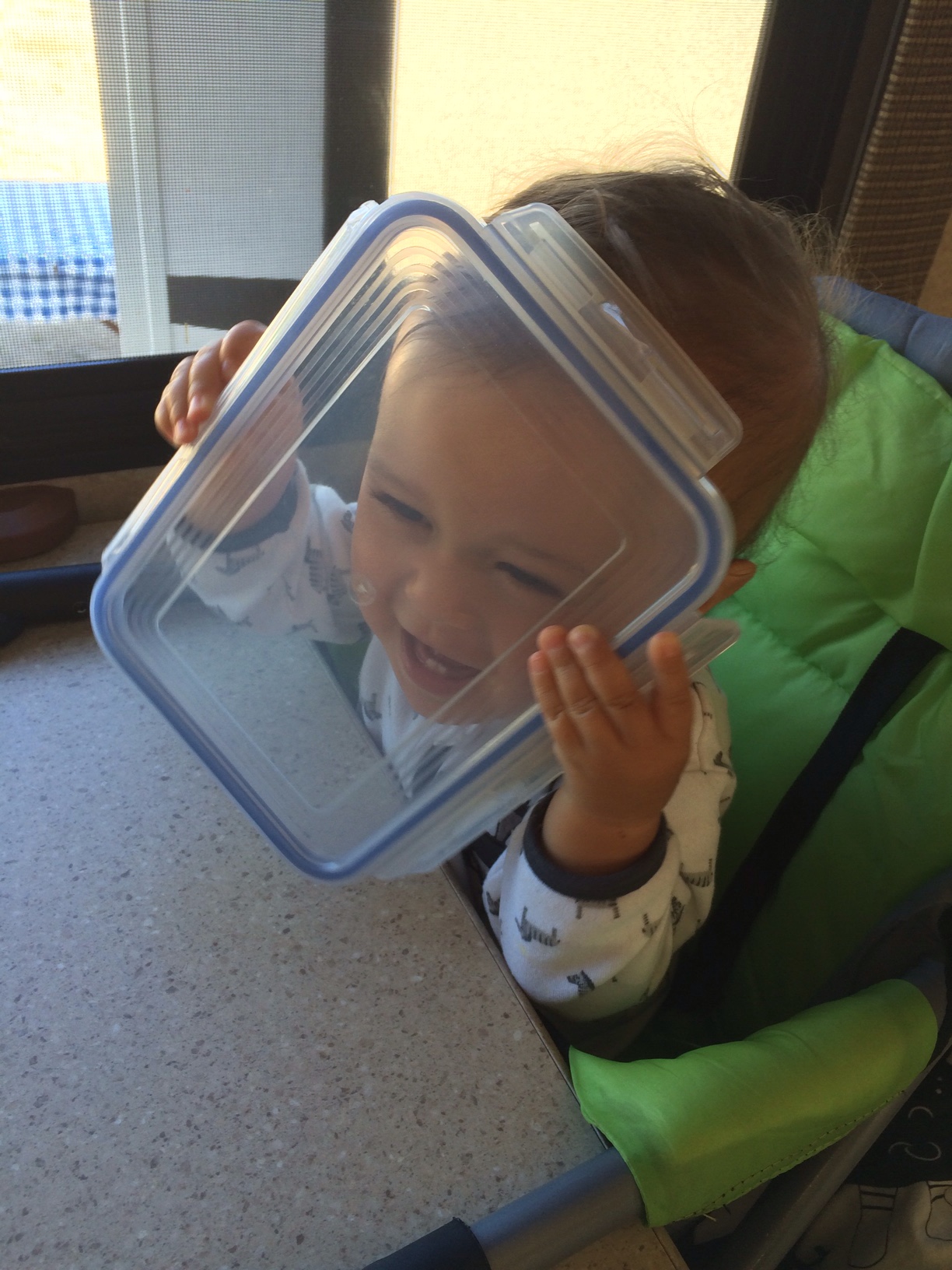 Baby boy o with plastic container 